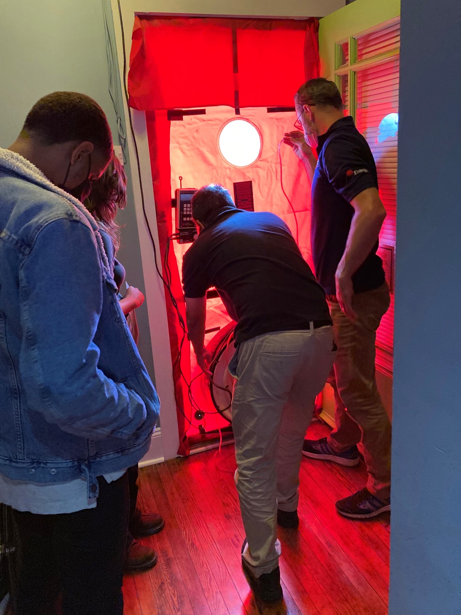Apprentices get an inside look at how to conduct a blower-door test to search for air leakage in homes.